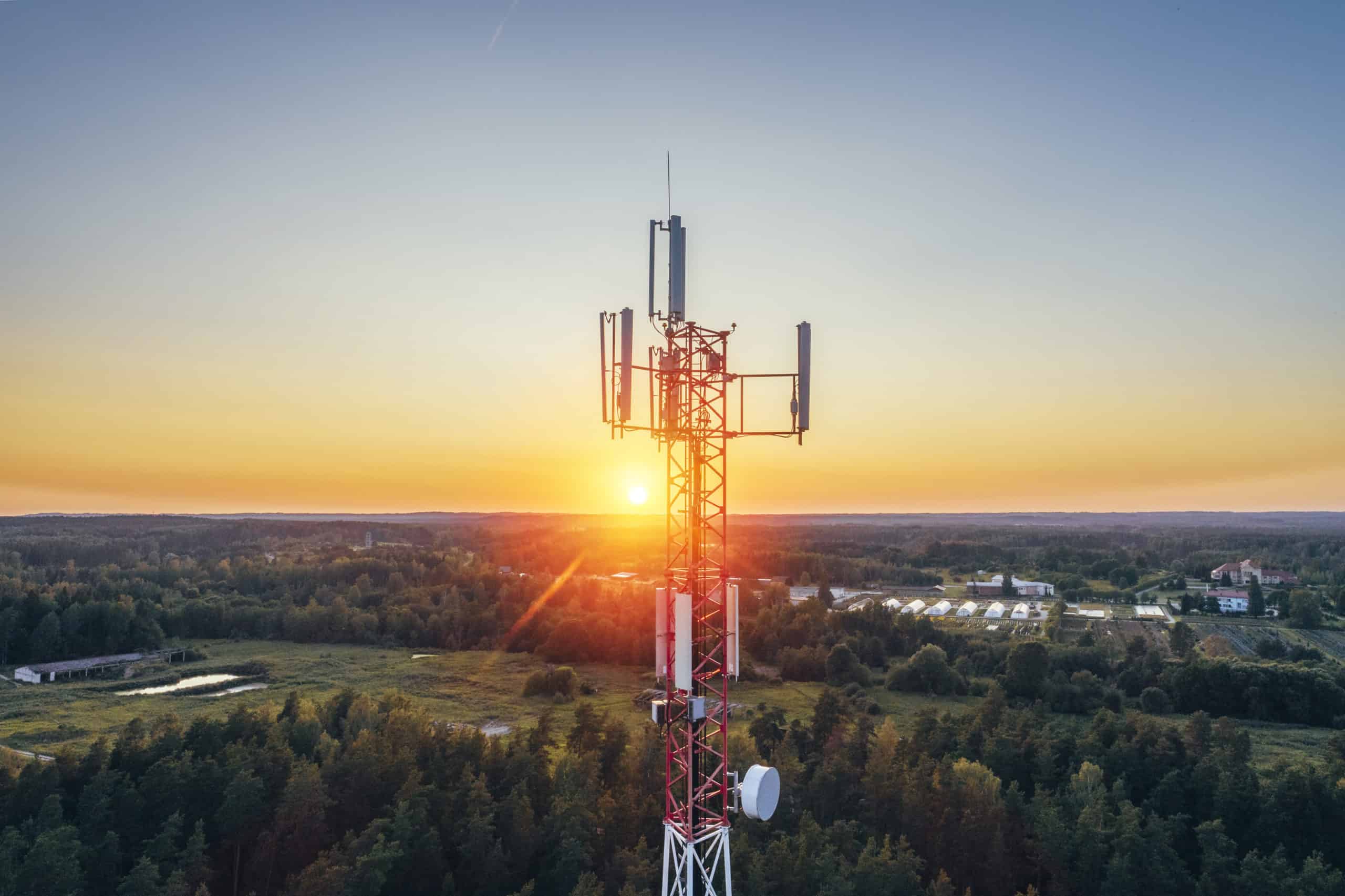 Mobile communication tower during sunset from above.