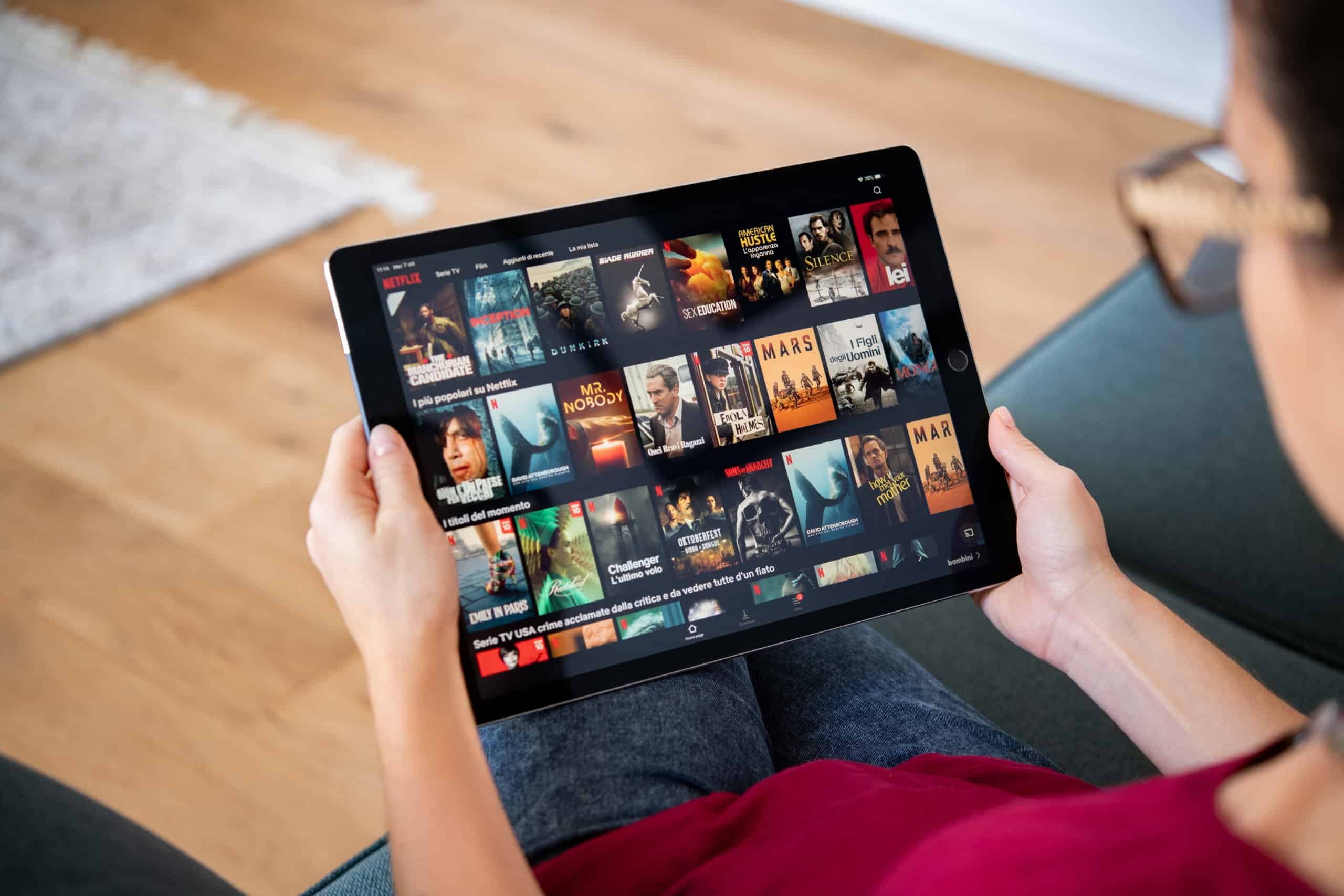 Bologna, Italy – 22 October 2020: Woman watching Netflix on digital tablet